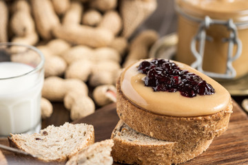 Homemade Healthy Breakfast. Peanut Butter and Jelly on Dark Wooden Background.