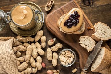 Homemade Healthy Breakfast. Peanut Butter and Jelly on Dark Wooden Background.