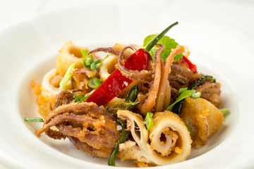 Fried Squids Tentacle Calamari with Chili Pepper and Mint Leaves