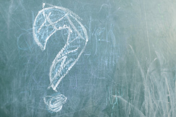 Chalkboard with wooden frame and the text question sign