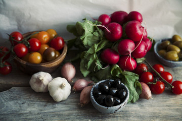 Heap of fresh raw vegetables on wooden background. Ingredients concept