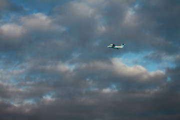 Plane in cloudy sky. Sheremetyevo, Moscow, Russia