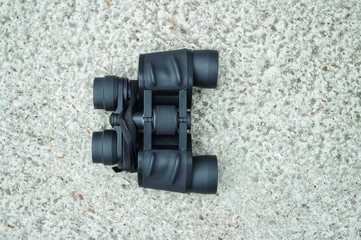 binoculars on stone and copy space