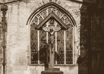 Cross Outside Church in Sepia Tone, shallow depth of field