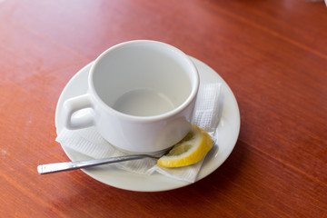 white Cup on saucer. teacup. Cup on saucer with lemon