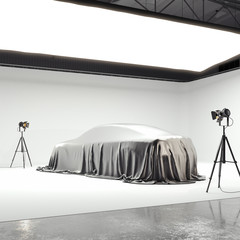 Photographic studio with covered car and several light sources. 3d rendering