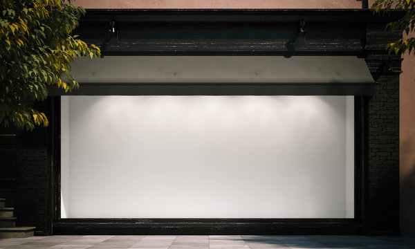 Blank Shop Window In The Night Street With Light On The Frame. 3d Rendering