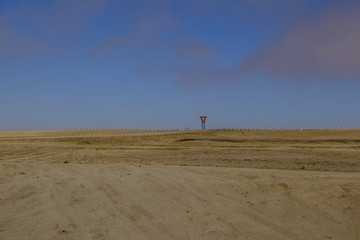 Yield sign Namibia landscape