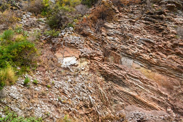 Texture of the rock. Large rocks exfoliate from the rock.