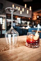 Negroni cocktail on dark wooden table