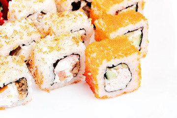 Sushi on a white background. A lot of rolls on a white background.