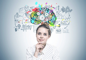 Smiling young woman dreaming, cog brain