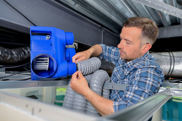Man installing air conditioning