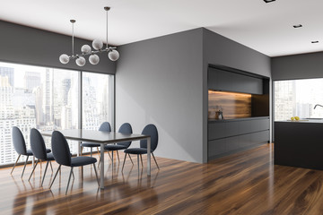 Gray dining room and kitchen corner, city view