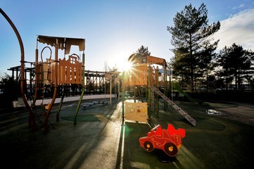Empty Children kid playground for leisure and recreation activity with toy in the park in childhood color style and tree with sunlight background.Urban neighborhood childhood concept.