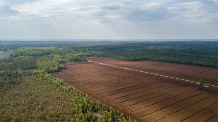 Naklejka premium drone image. aerial view of cultivated turf fields in the swamp
