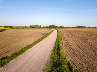 Naklejka premium drone image. aerial view of rural area with cultivated fields of rape seed