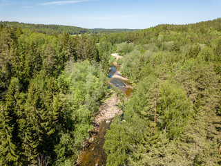 drone image. aerial view of rural area with river in forest