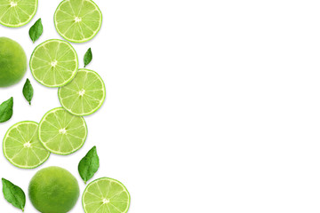 Pattern of citrus fruits.Fresh organic ripe lemon and lime with green leaves isolated on white background.Top view,flat lay with copy space empty blank for text.Food background, wallpaper.