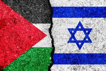 Flags of Israel and Palestine painted on cracked wall background/Israel - Palestinian conflict...