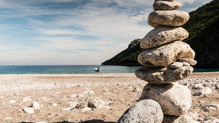 Stone stack on beach sea shore.