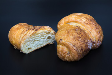 croissant on a dark blue background. french food 