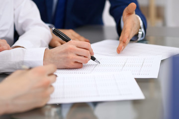 Fototapeta premium Bookkeepers team or financial inspectors making report, calculating and checking balance. Tax service financial document. Audit or meeting concept