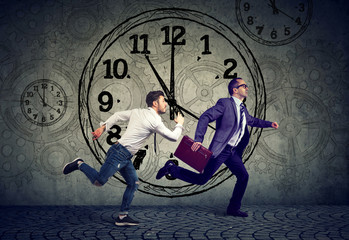 Running businessman execute and casual entreprenur in rivalry