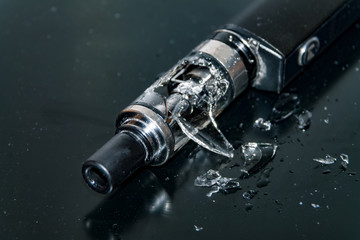 Broken glass in an electric cigarette, broken cigarette