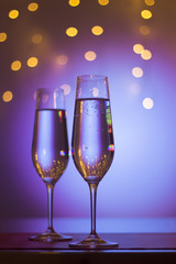 Champagne glasses in disco party bar