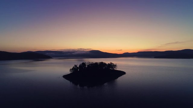 Morning fog on the mountain lake, sunrise shot