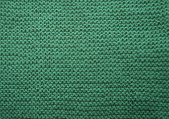 Green knitted fabric background texture