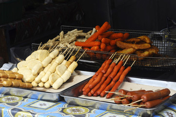 Sausages and other processed foods are pecked with skewers and served. Sell by street hawkers in...