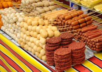 Sausages and other processed foods are pecked with skewers and served. Sell by street hawkers in...