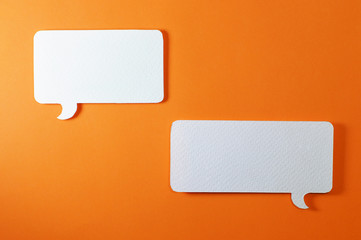 couple of rectangle text bubble on orange background