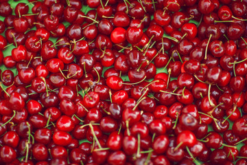 fresh bright red cherries, in the weekly market, can be used as background