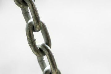Iron chain on a white background. Close-up.