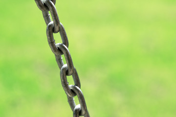 Iron chain on a white background. Close-up.