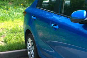 Fototapeta premium The back of the blue car.
