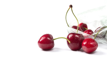 Obraz na płótnie Canvas Ripe red cherry on a white background.