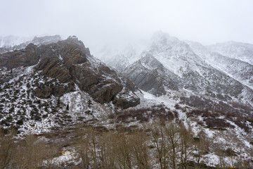 Obraz premium The Sierra Nevada stands out half covered in snow in the winter