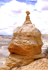 Pocked and weathered sandstone formation like a cathedral in the Bisti Badlands of North West New Mexico.