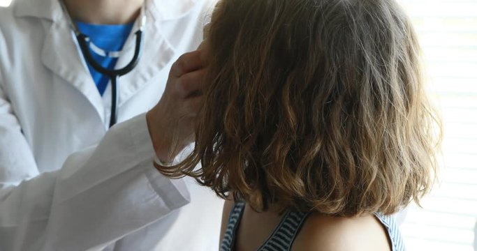 pediatrician checks a little girl then she goes