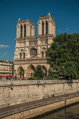 People, tree-lined Seine River and gothic Notre-Dame Cathedral at Paris. Known as the “City of Light”, is one of the most impressive world’s cultural center. Northern France.