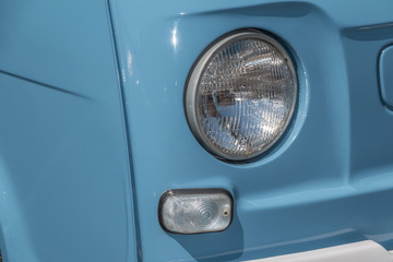 Obraz na płótnie Canvas 自動車のヘッドライト　Headlight of the old car