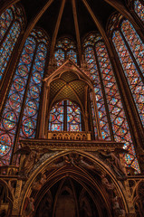 Stained glass windows and baldachin at the Sainte-Chapelle (church) in Paris. Known as the “City of Light”, is one of the most awesome world’s cultural center. Northern France. © Celli07