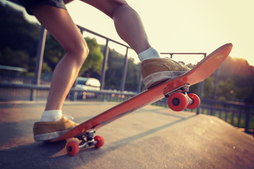 skateboarder skateboarding on skatepark ramp