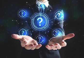 Question Marks with businessman on a black background 