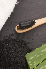 Toothbrush with black charcoal toothpaste with aloe vera