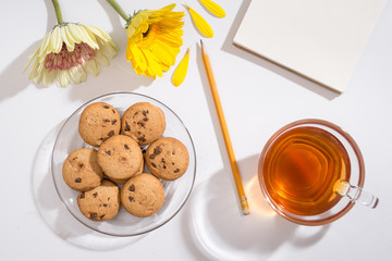 workspace with notebook keyboard, sketchbook, diary, coffee on white background. Flat lay, top view office table desk.